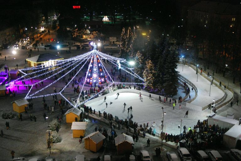 Night aerial view of the seasonal ice rink at Unity Square in Daugavpils