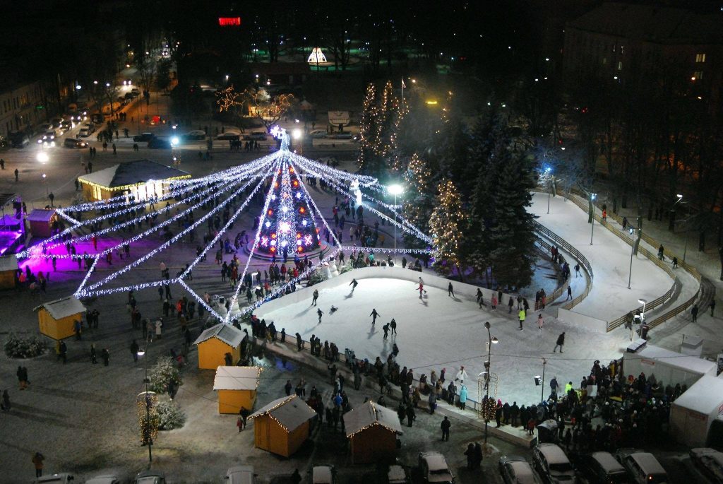 Night view of the seasonal ice rink at Unity Square in Daugavpils