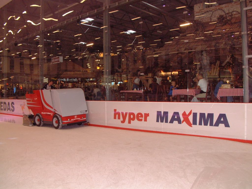 Ice rink boards surrounding the permanent indoor rink at Vilnius Akropolis