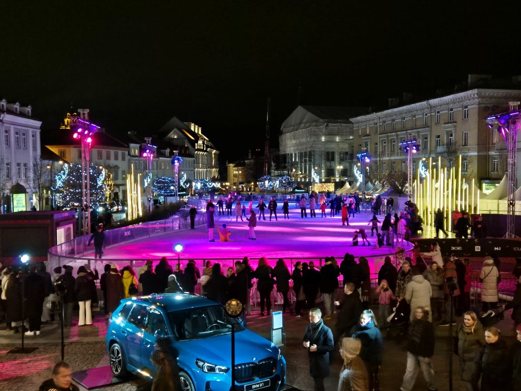 Night view of the seasonal ice rink at Vilnius Town Hall Square
